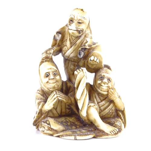 269 - A 19th century Japanese ivory netsuke, depicting 3 figures, signed, height 5cm