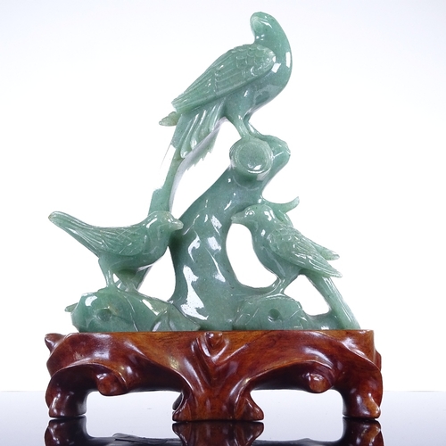 281 - A Chinese jadeite carving, depicting 3 exotic birds, on hardwood stand, height 20cm