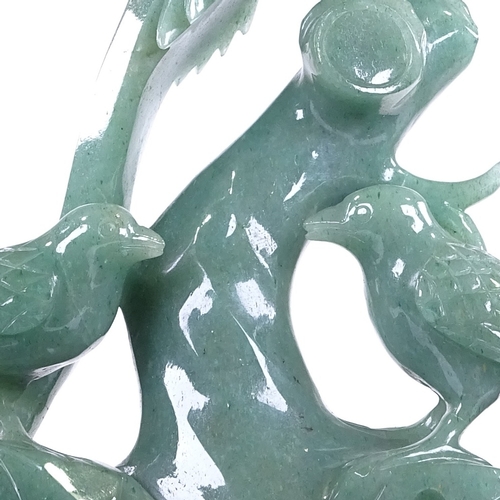 281 - A Chinese jadeite carving, depicting 3 exotic birds, on hardwood stand, height 20cm