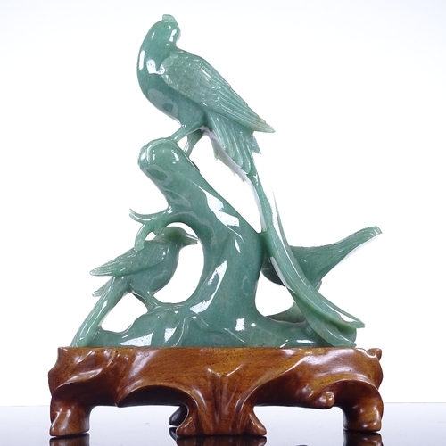 281 - A Chinese jadeite carving, depicting 3 exotic birds, on hardwood stand, height 20cm