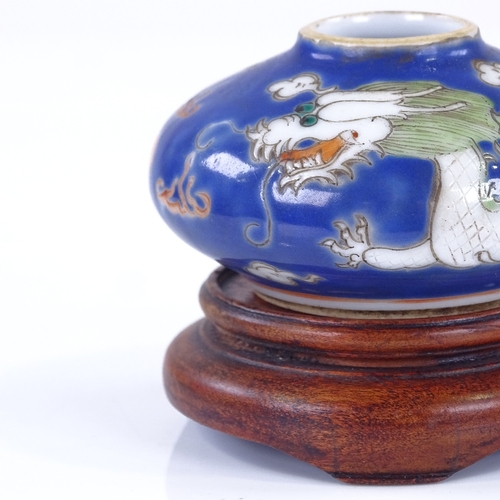 288 - A small Chinese porcelain brush pot, with painted dragon design, diameter 6cm