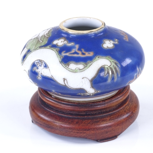 288 - A small Chinese porcelain brush pot, with painted dragon design, diameter 6cm