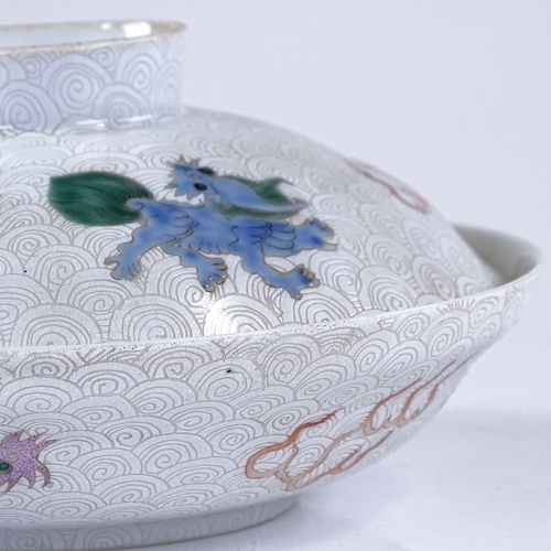 289 - A Chinese white glaze porcelain bowl and cover, painted enamel dragons and sea creatures, 6 characte... 