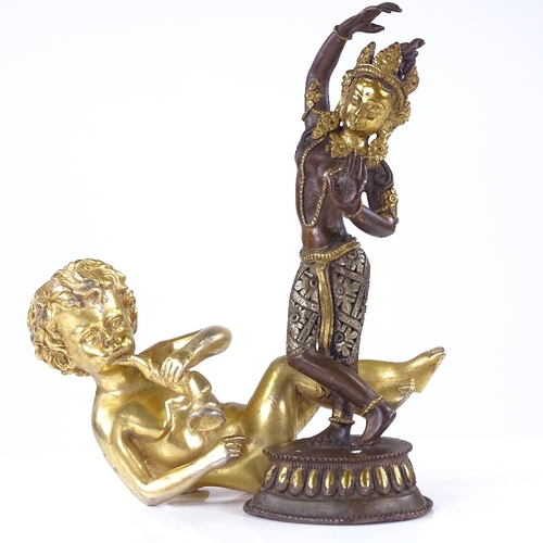 291 - An Indian parcel gilt-bronze dancing Buddha, height 20cm, and a gilt-bronze seated cherub (2)