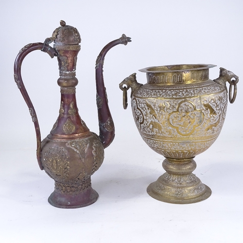 309 - An Indian engraved brass 2-handled pot, height 32cm, and a Continental copper and brass ewer (2)