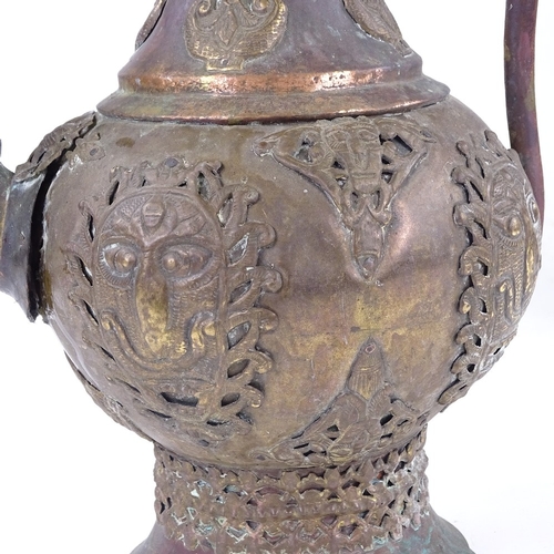 309 - An Indian engraved brass 2-handled pot, height 32cm, and a Continental copper and brass ewer (2)