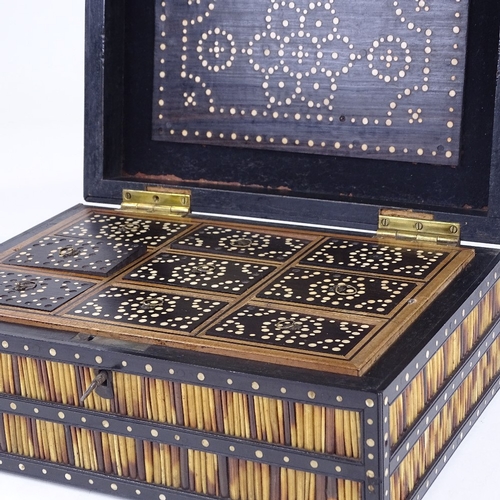 310 - A 19th century ebony and porcupine quill box, with inlaid ivory discs and fitted interior, width 30c... 