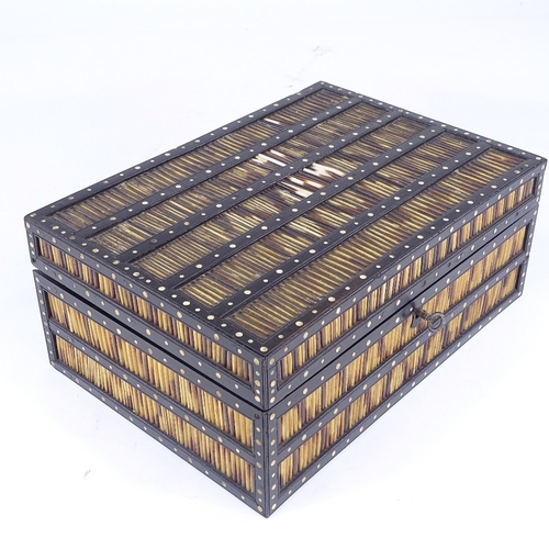 310 - A 19th century ebony and porcupine quill box, with inlaid ivory discs and fitted interior, width 30c... 