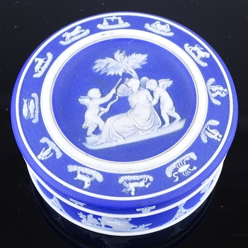 313 - A Wedgwood blue Jasper circular pot and cover, diameter 8.5cm