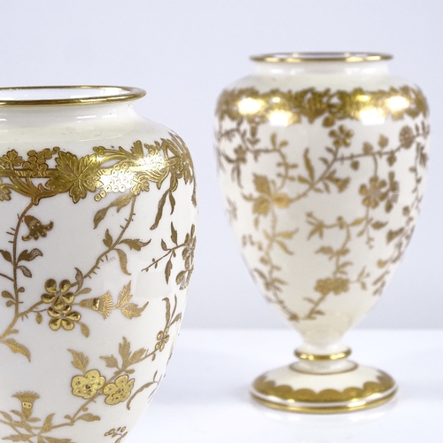 316 - A pair of Minton cream ground china vases with gilded floral decoration, height 13cm