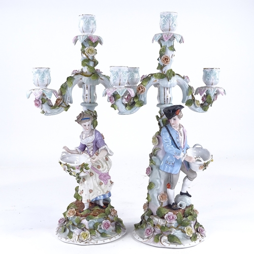 340 - A pair of Continental porcelain 3-branch candelabra, supported by country figures, height 42cm