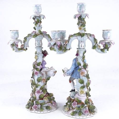 340 - A pair of Continental porcelain 3-branch candelabra, supported by country figures, height 42cm