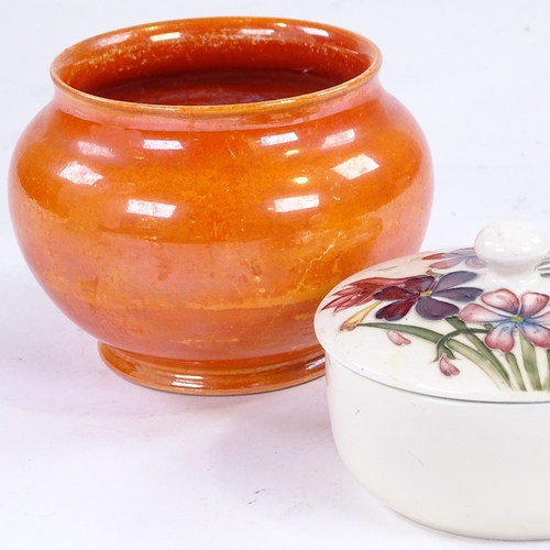 341 - Moorcroft Pottery pot and cover, diameter 11cm, and a Moorcroft orange lustre glaze bowl (2)