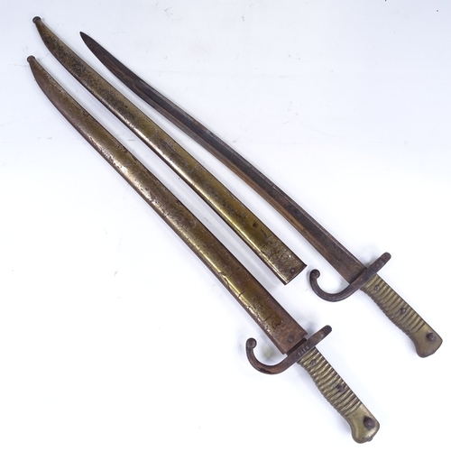 360 - A pair of 19th century sword bayonets with metal scabbards