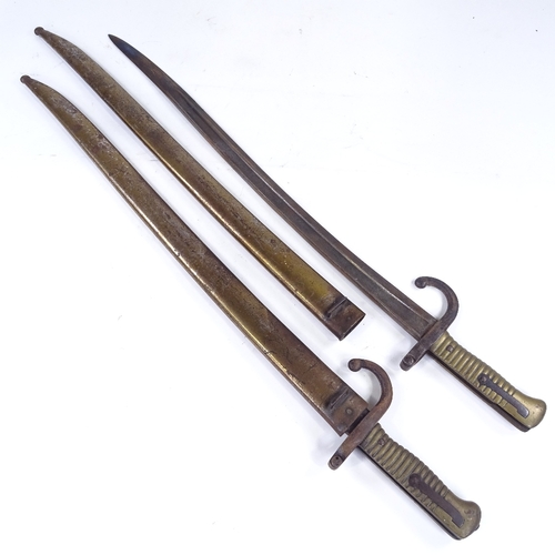 360 - A pair of 19th century sword bayonets with metal scabbards