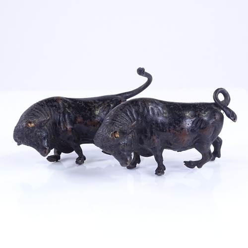 363 - A pair of miniature patinated bronze bulls, length 10cm