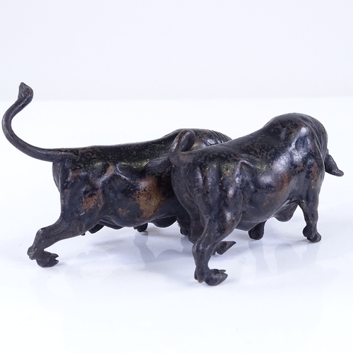 363 - A pair of miniature patinated bronze bulls, length 10cm