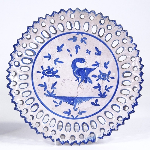 85 - A Wedgwood Creamware basket weave design ribbon plate, diameter 28cm, and a Continental tin glazed p... 