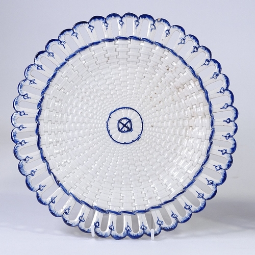 85 - A Wedgwood Creamware basket weave design ribbon plate, diameter 28cm, and a Continental tin glazed p... 