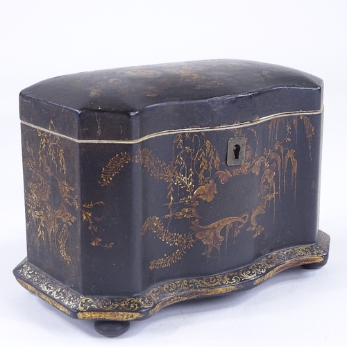 90 - A Victorian papier mache tea caddy, painted and gilded floral decoration, with serpentine front and ... 