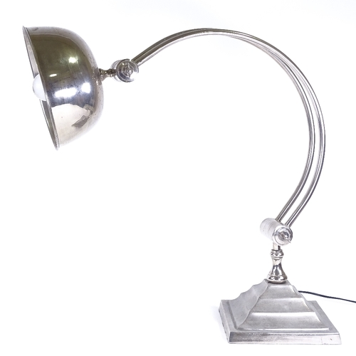 92 - A large aluminium Art Deco style table lamp, with curved support on square base, base 25cm across, h... 