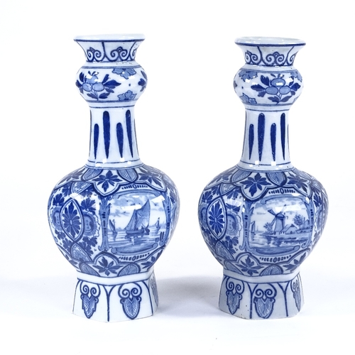 94 - A pair of Delft blue and white glaze narrow-neck vases, with harbour scenes, height 27cm, late 19th/... 