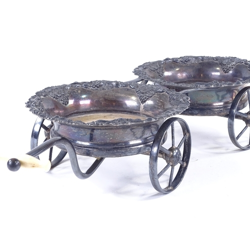 98 - A 19th century Sheffield plate wheeled decanter coaster trolley, with relief cast grapevine surround... 