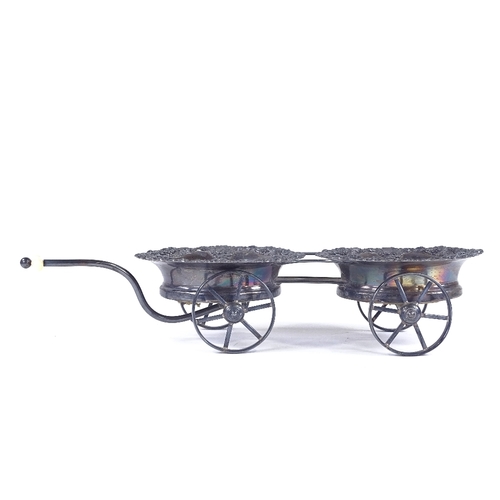 98 - A 19th century Sheffield plate wheeled decanter coaster trolley, with relief cast grapevine surround... 