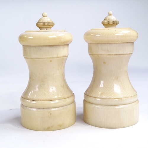 398 - A pair of 19th century ivory pepper grinders, height 10cm