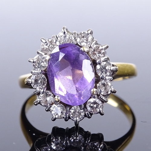 661 - A late 20th century 18ct gold amethyst and diamond cluster ring, total diamond content approx 0.25ct... 