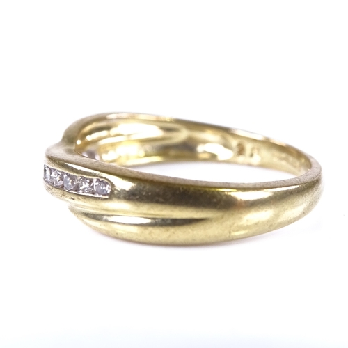 663 - A modern 9ct gold diamond cross-over ring, total diamond content approx 0.15ct, setting height 4.8mm... 