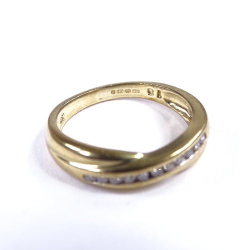 663 - A modern 9ct gold diamond cross-over ring, total diamond content approx 0.15ct, setting height 4.8mm... 