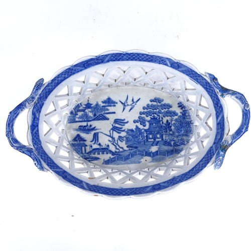 200A - A 19th century blue and white transfer printed Creamware basket, with pierced lattice sides, length ... 