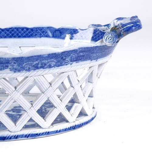 200A - A 19th century blue and white transfer printed Creamware basket, with pierced lattice sides, length ... 