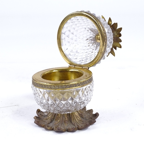 270A - A late 1930s Cristal et Bronze cut-glass and gilt-metal novelty desk inkwell, modelled as a pineappl... 