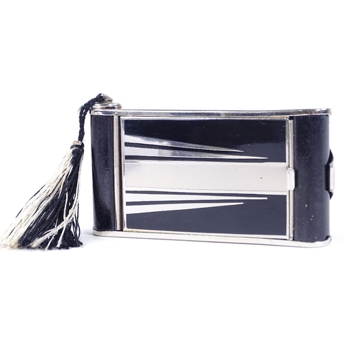 290A - An Art Deco chrome plate and black enamel combination compact/cigarette case, in the form of a foldi... 