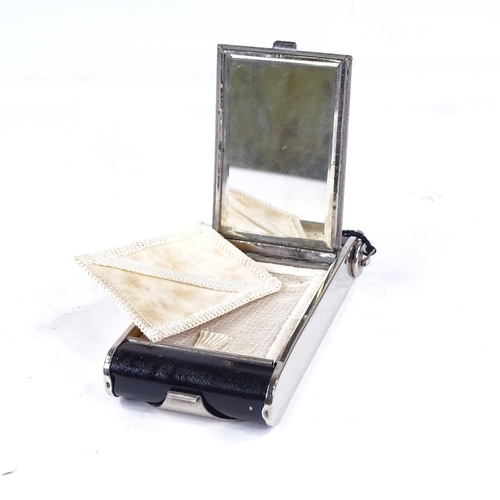 290A - An Art Deco chrome plate and black enamel combination compact/cigarette case, in the form of a foldi... 