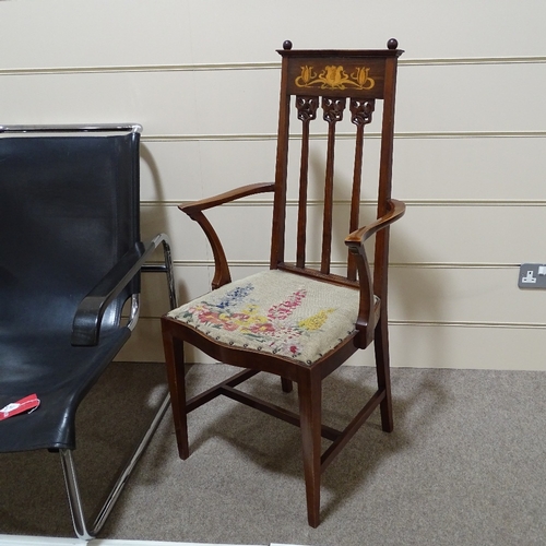 279 - An English walnut Art Nouveau marquetry inlaid elbow chair, in the manner of Liberty & Co