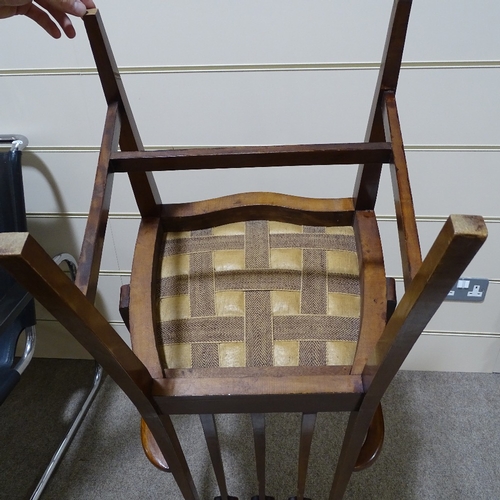 279 - An English walnut Art Nouveau marquetry inlaid elbow chair, in the manner of Liberty & Co