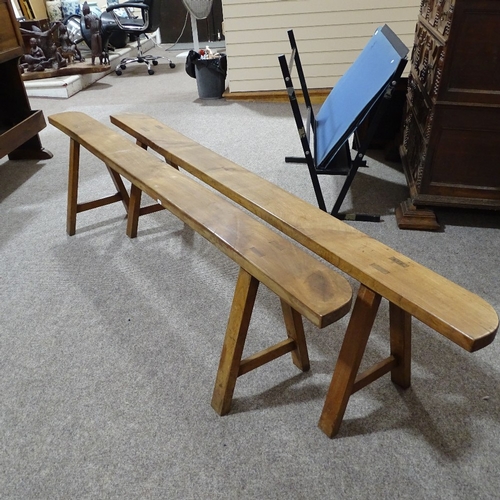 280 - A pair of 19th century French fruitwood trestle type benches, length 2m