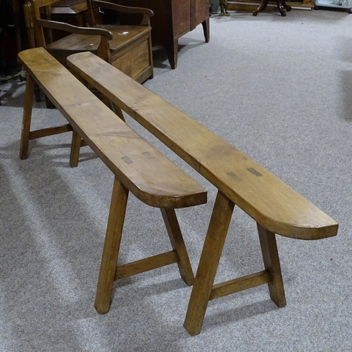 280 - A pair of 19th century French fruitwood trestle type benches, length 2m