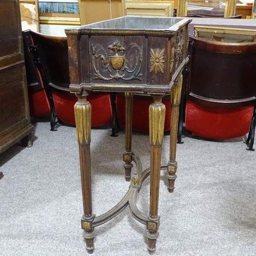 324 - A 19th century French parcel gilt and walnut jardiniere, with zinc liner, and relief moulded decorat... 