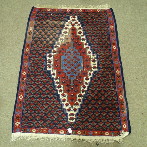 343 - A Kilim red and blue ground floral pattern rug