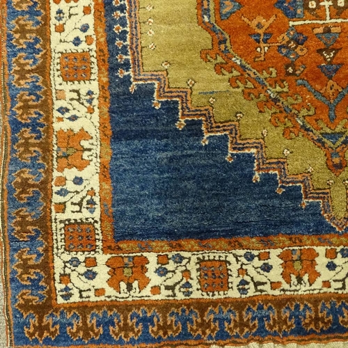 358 - A hand woven Persian red and blue ground wool rug