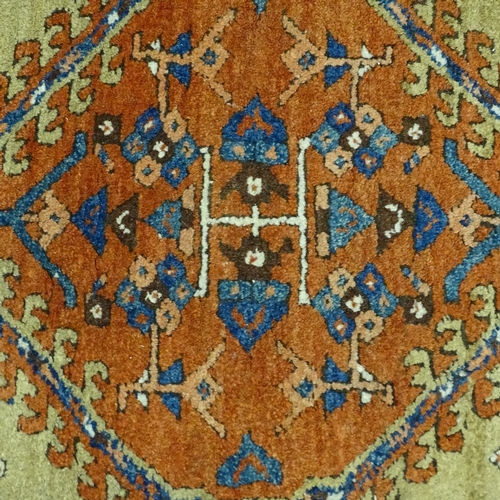 358 - A hand woven Persian red and blue ground wool rug