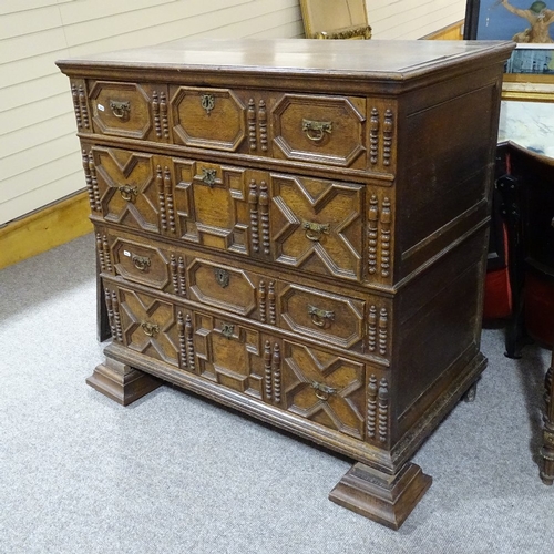 392 - A late 17th/early 18th century oak chest of 4 long drawers, with applied moulded and split turned dr... 