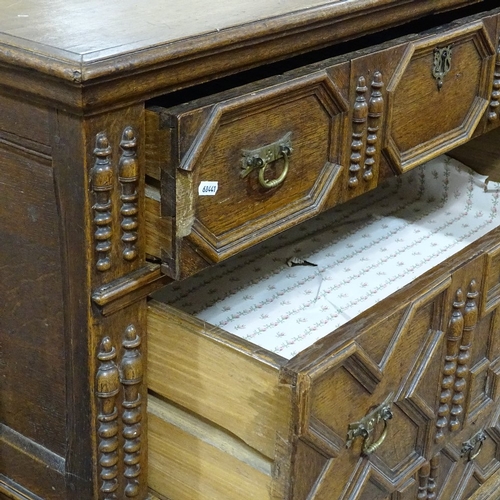 392 - A late 17th/early 18th century oak chest of 4 long drawers, with applied moulded and split turned dr... 