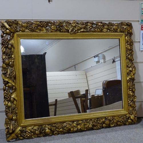 393 - A large Victorian gilt-gesso framed wall mirror, with fruit decorated surround, overall dimensions 9... 