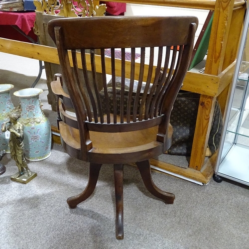 396 - A late 19th century mahogany bow-arm office chair