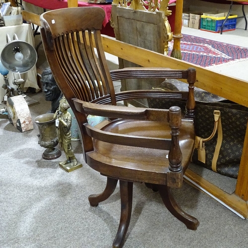 396 - A late 19th century mahogany bow-arm office chair